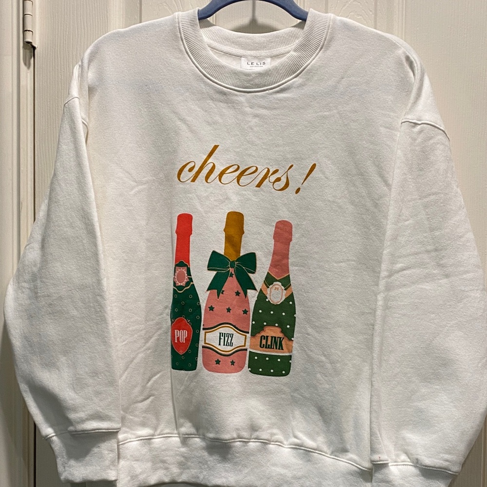 Le Lis White Sweatshirt with Festive Champagne Bottle Design